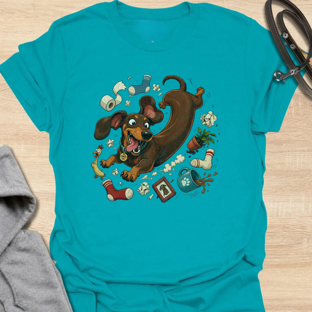 Funny dachshund t-shirt featuring a wild and mischievous doxie surrounded by total household chaos. The “Chaos Reigns” design is perfect for dachshund owners who know these little dogs may be small, but they bring huge personality, energy, and trouble wherever they go. With its playful artwork and humorous theme, this shirt is a great fit for dog moms, dog dads, and anyone obsessed with funny wiener dog apparel. It also makes a great gift for dachshund lovers who appreciate the messy, lovable, and completel