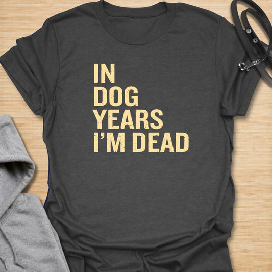 In Dog Years t-shirt for dog lovers with a dark sense of humor and a love for bold, simple text designs. The distressed lettering reads “In Dog Years I’m Dead,” making it a funny gift for pet parents, dog owners, and anyone who jokes about aging. Great for casual wear, birthdays, and dog people who like sarcastic humor.