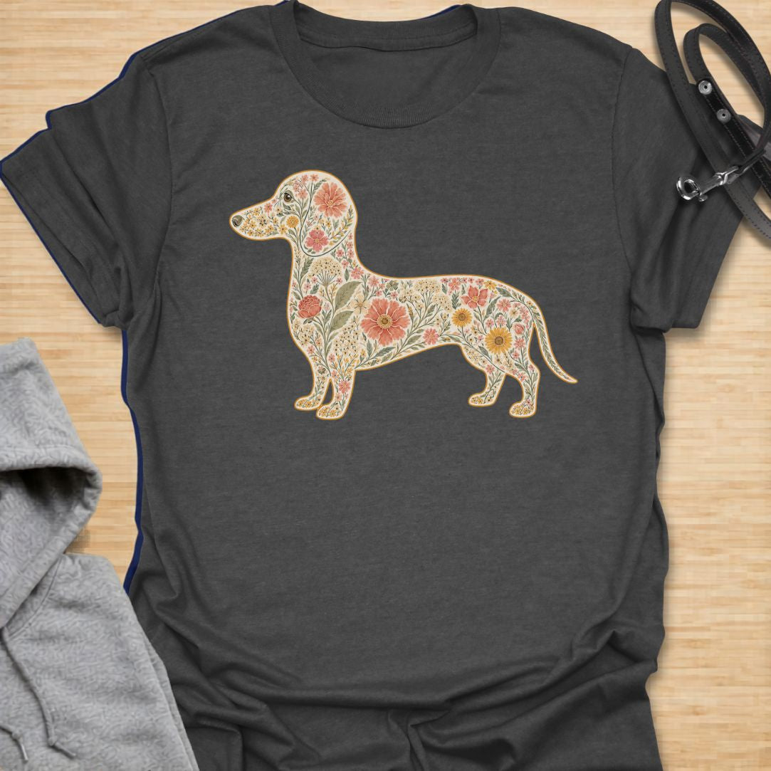 This Floral Dachshund t-shirt is made for doxie lovers who want a beautiful, botanical take on their favorite long dog. Featuring a dachshund silhouette filled with intricate flowers, leaves, vines, and vintage-style floral details, this design blends dog-lover charm with soft garden-inspired artwork. Perfect for dachshund moms, dachshund dads, wiener dog lovers, sausage dog fans, botanical art lovers, and anyone who loves both dogs and flowers.