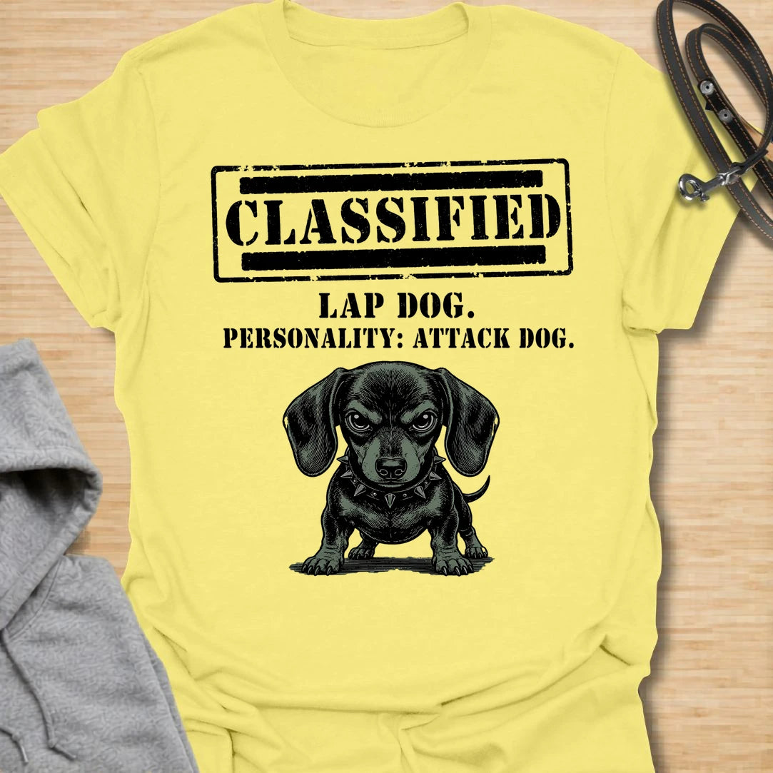 This Classified Lap Dog Personality Attack Dog t-shirt is made for dachshund lovers who know their tiny dog has serious main-character energy. Featuring a classified stamp-style layout, bold text, and a fierce little dachshund illustration, this design has a funny breed-specific attitude that doxie owners will instantly understand. Perfect for dachshund moms, dachshund dads, wiener dog fans, rescue dog lovers, and anyone whose lap dog acts like personal security.