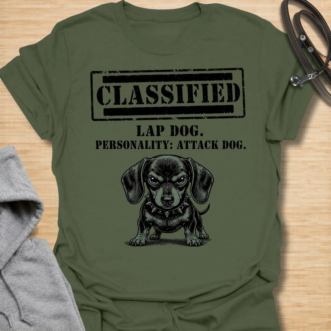 This Classified Lap Dog Personality Attack Dog t-shirt is made for dachshund lovers who know their tiny dog has serious main-character energy. Featuring a classified stamp-style layout, bold text, and a fierce little dachshund illustration, this design has a funny breed-specific attitude that doxie owners will instantly understand. Perfect for dachshund moms, dachshund dads, wiener dog fans, rescue dog lovers, and anyone whose lap dog acts like personal security.