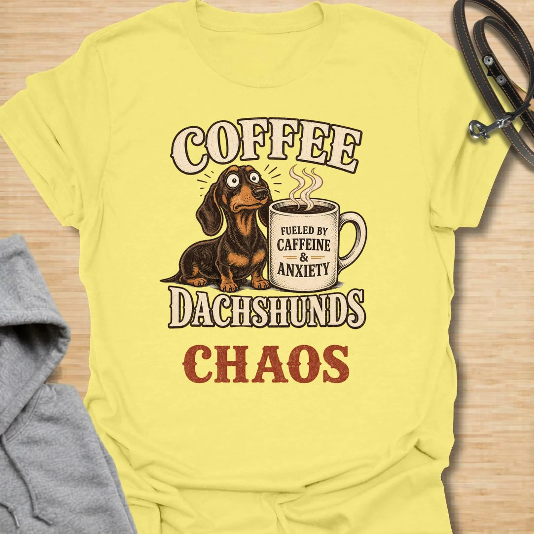 This Coffee Dachshunds Chaos t-shirt is made for doxie lovers who run on caffeine, anxiety, and tiny long-dog drama. Featuring a wide-eyed dachshund beside a coffee mug with bold retro lettering, this funny dog design is great for dachshund moms, dachshund dads, coffee lovers, wiener dog fans, rescue dog lovers, and anyone whose day is fueled by dachshunds and chaos.