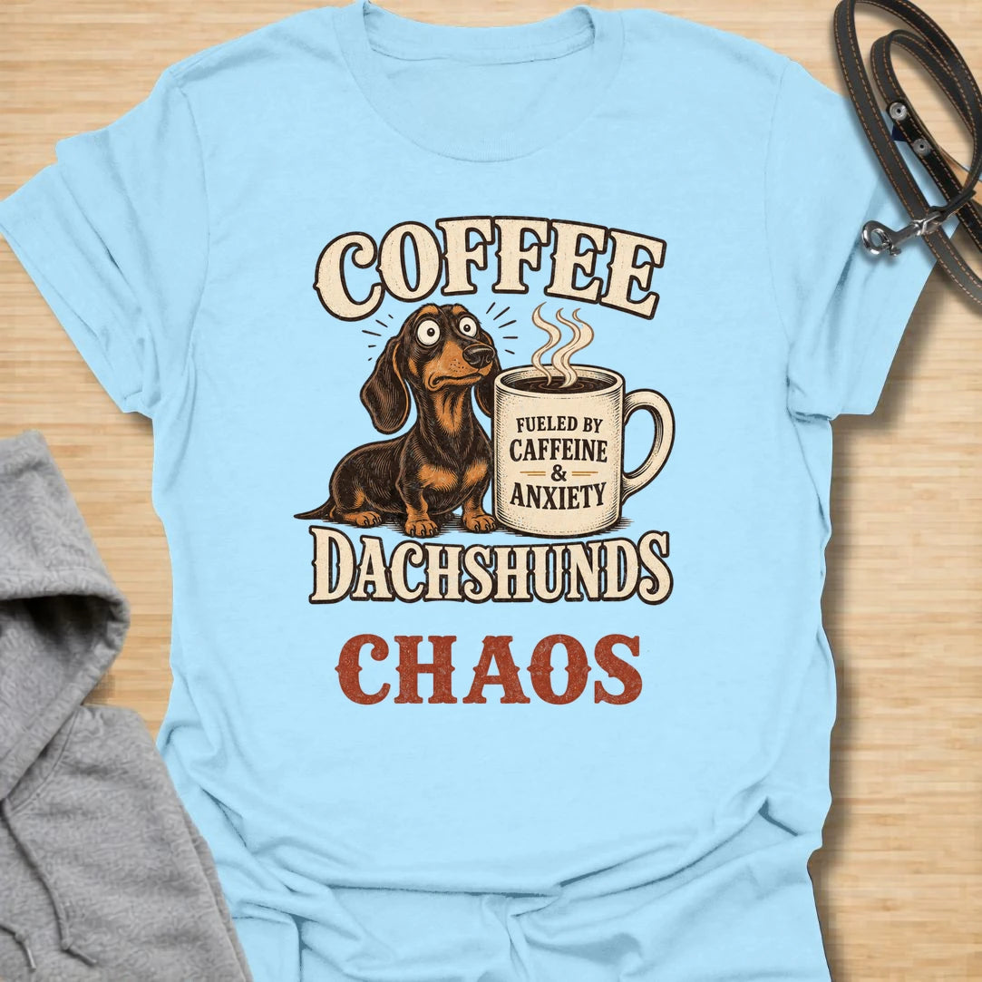 This Coffee Dachshunds Chaos t-shirt is made for doxie lovers who run on caffeine, anxiety, and tiny long-dog drama. Featuring a wide-eyed dachshund beside a coffee mug with bold retro lettering, this funny dog design is great for dachshund moms, dachshund dads, coffee lovers, wiener dog fans, rescue dog lovers, and anyone whose day is fueled by dachshunds and chaos.