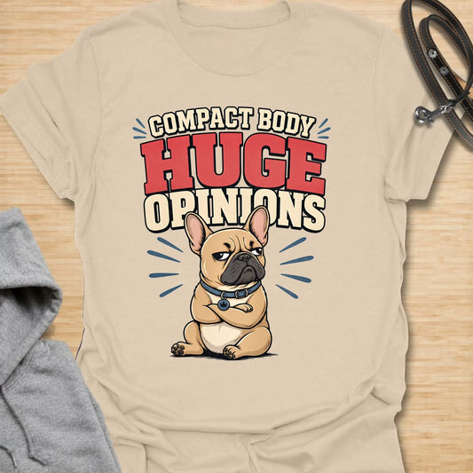 This Compact Body Huge Opinions t-shirt is made for French Bulldog lovers who know their little dog has no shortage of attitude. Featuring a grumpy cartoon Frenchie with folded arms, bold retro lettering, and a funny breed-specific message, this design has a playful dog-parent feel that Frenchie owners will instantly understand. Perfect for Frenchie moms, Frenchie dads, French Bulldog owners, rescue dog lovers, and anyone whose small dog has a very big personality.