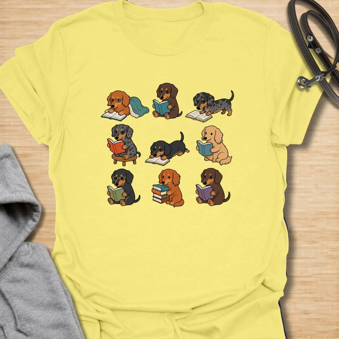 Dachshund Book Club t-shirt for readers who love books almost as much as they love doxies. This sweet design features a group of adorable dachshunds enjoying their books in a cute, cozy book club style. A lovely gift for dachshund moms, dachshund dads, book lovers, teachers, librarians, readers, and anyone who loves sausage dogs. Perfect for casual wear, bookshops, library days, dog walks, reading groups, or cozy weekends.