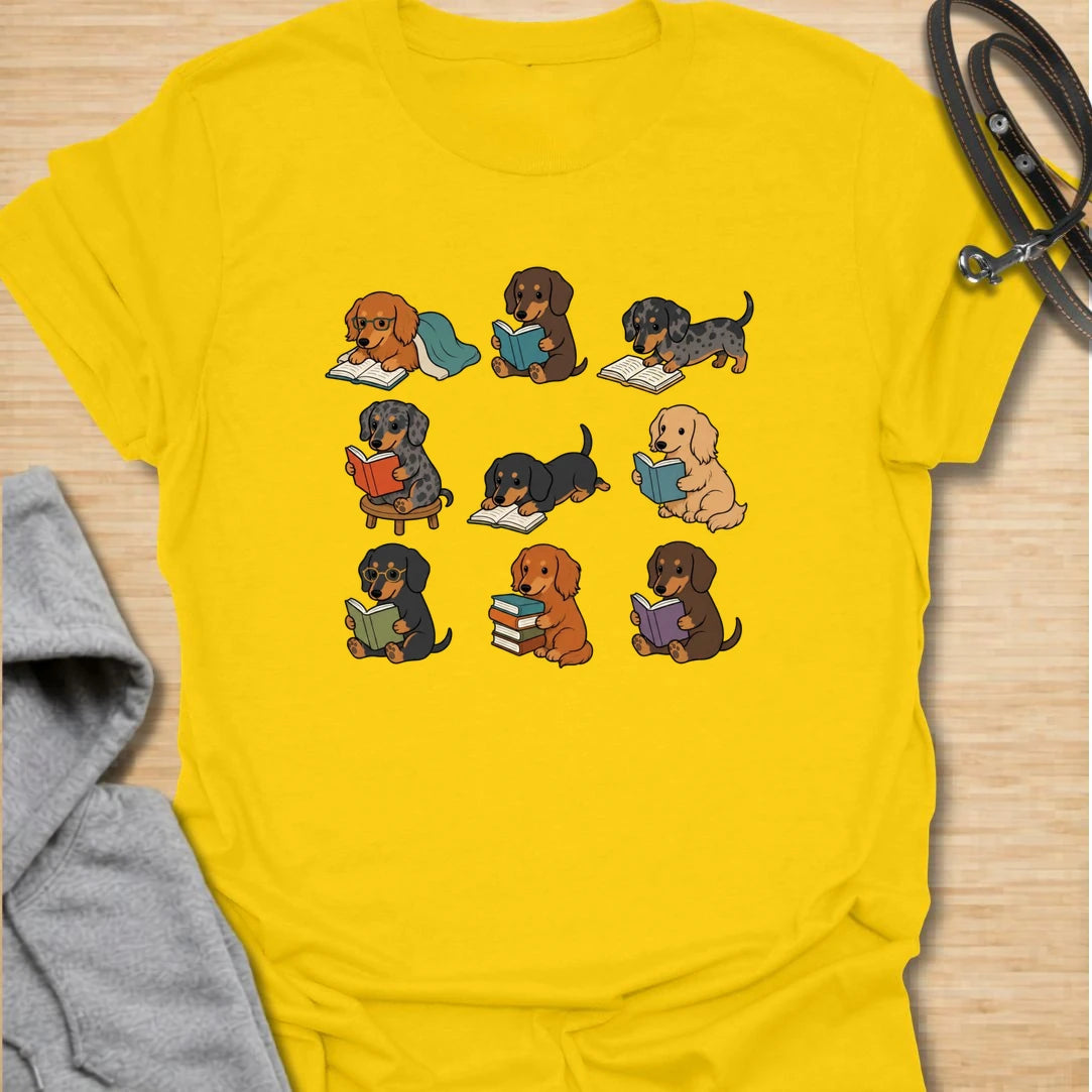 Dachshund Book Club t-shirt for readers who love books almost as much as they love doxies. This sweet design features a group of adorable dachshunds enjoying their books in a cute, cozy book club style. A lovely gift for dachshund moms, dachshund dads, book lovers, teachers, librarians, readers, and anyone who loves sausage dogs. Perfect for casual wear, bookshops, library days, dog walks, reading groups, or cozy weekends.