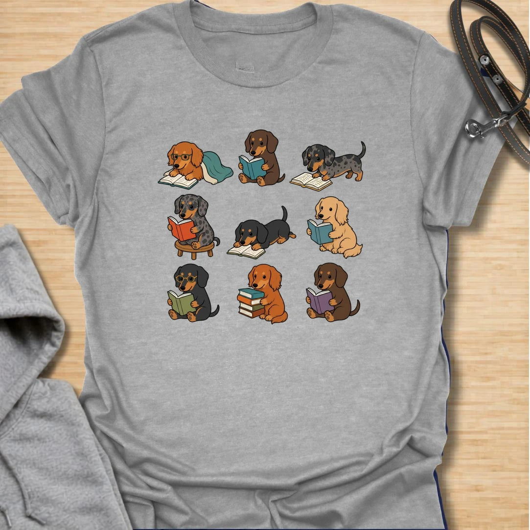 Dachshund Book Club t-shirt for readers who love books almost as much as they love doxies. This sweet design features a group of adorable dachshunds enjoying their books in a cute, cozy book club style. A lovely gift for dachshund moms, dachshund dads, book lovers, teachers, librarians, readers, and anyone who loves sausage dogs. Perfect for casual wear, bookshops, library days, dog walks, reading groups, or cozy weekends.