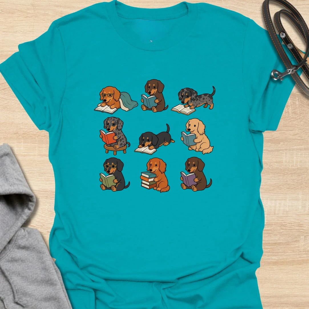 Dachshund Book Club t-shirt for readers who love books almost as much as they love doxies. This sweet design features a group of adorable dachshunds enjoying their books in a cute, cozy book club style. A lovely gift for dachshund moms, dachshund dads, book lovers, teachers, librarians, readers, and anyone who loves sausage dogs. Perfect for casual wear, bookshops, library days, dog walks, reading groups, or cozy weekends.