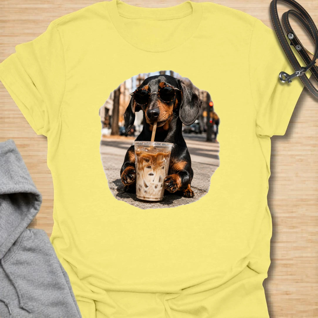 This dachshund iced coffee t-shirt is made for dog lovers who run on caffeine and doxie attitude. The cool dachshund in round sunglasses with an iced coffee gives the design a trendy, coffee-shop feel. It is perfect for dachshund moms, coffee lovers, and anyone who thinks their dog has main-character energy. A fun everyday shirt for iced coffee runs, casual weekends, dog walks, or gifting to a dachshund-obsessed friend.