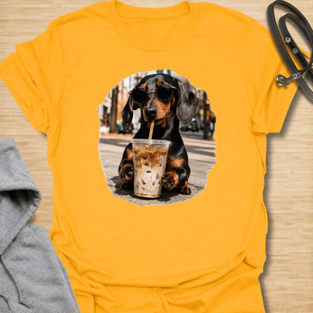 This dachshund iced coffee t-shirt is made for dog lovers who run on caffeine and doxie attitude. The cool dachshund in round sunglasses with an iced coffee gives the design a trendy, coffee-shop feel. It is perfect for dachshund moms, coffee lovers, and anyone who thinks their dog has main-character energy. A fun everyday shirt for iced coffee runs, casual weekends, dog walks, or gifting to a dachshund-obsessed friend.