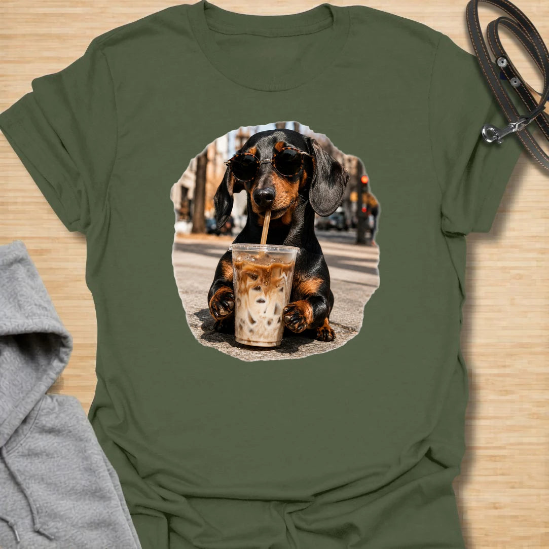 This dachshund iced coffee t-shirt is made for dog lovers who run on caffeine and doxie attitude. The cool dachshund in round sunglasses with an iced coffee gives the design a trendy, coffee-shop feel. It is perfect for dachshund moms, coffee lovers, and anyone who thinks their dog has main-character energy. A fun everyday shirt for iced coffee runs, casual weekends, dog walks, or gifting to a dachshund-obsessed friend.
