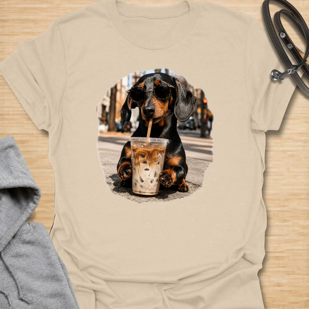 This dachshund iced coffee t-shirt is made for dog lovers who run on caffeine and doxie attitude. The cool dachshund in round sunglasses with an iced coffee gives the design a trendy, coffee-shop feel. It is perfect for dachshund moms, coffee lovers, and anyone who thinks their dog has main-character energy. A fun everyday shirt for iced coffee runs, casual weekends, dog walks, or gifting to a dachshund-obsessed friend.