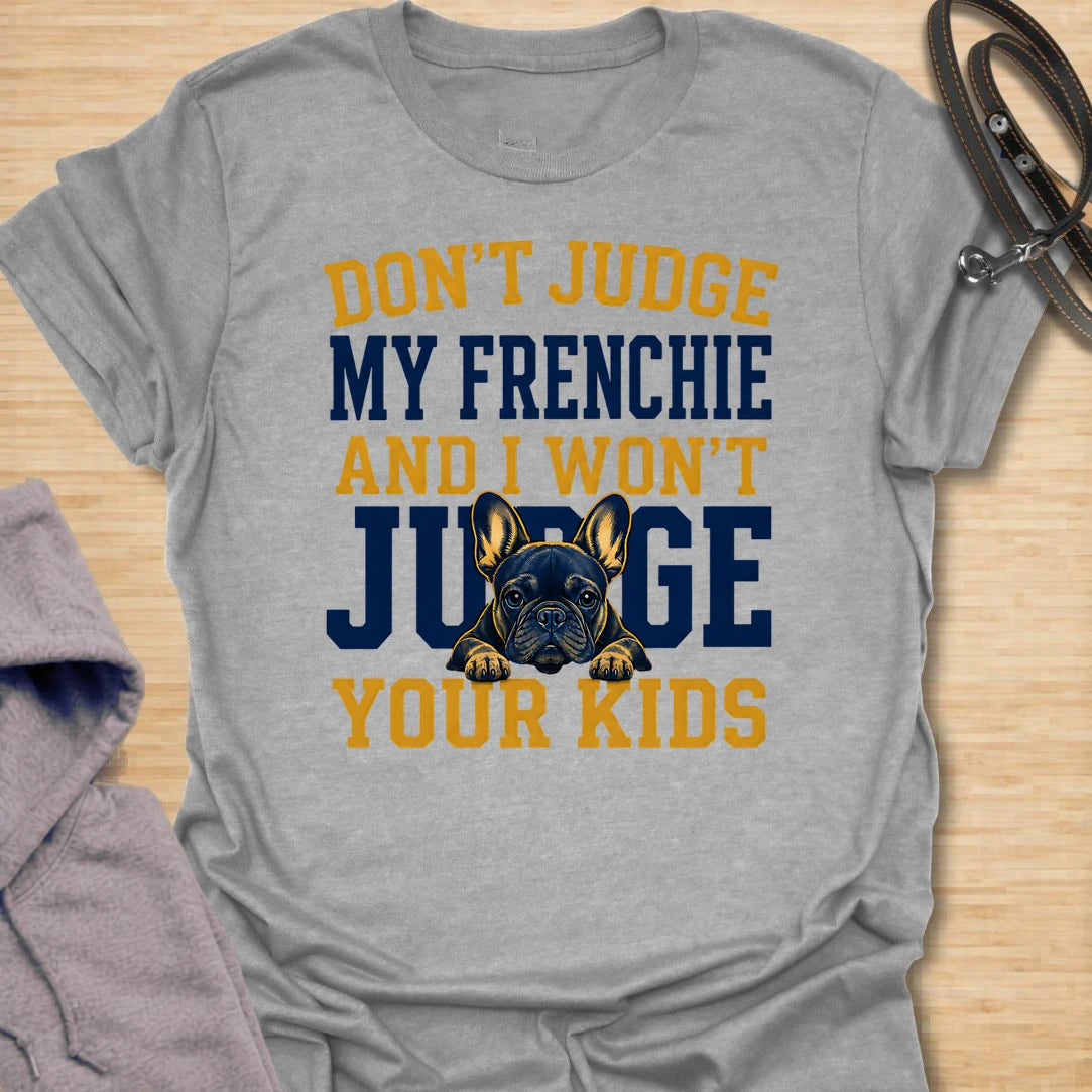 This Don’t Judge My Frenchie t-shirt is made for French Bulldog lovers who know their little dog may be chaotic, but judgment goes both ways. Featuring bold varsity-style lettering and a serious Frenchie peeking through the text, this design has a funny, protective dog-parent feel that Frenchie owners will instantly understand. Perfect for Frenchie moms, Frenchie dads, French Bulldog owners, rescue dog lovers, and anyone who knows their dog’s behavior is not up for discussion.