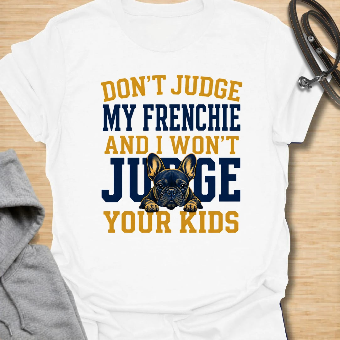 This Don’t Judge My Frenchie t-shirt is made for French Bulldog lovers who know their little dog may be chaotic, but judgment goes both ways. Featuring bold varsity-style lettering and a serious Frenchie peeking through the text, this design has a funny, protective dog-parent feel that Frenchie owners will instantly understand. Perfect for Frenchie moms, Frenchie dads, French Bulldog owners, rescue dog lovers, and anyone who knows their dog’s behavior is not up for discussion.