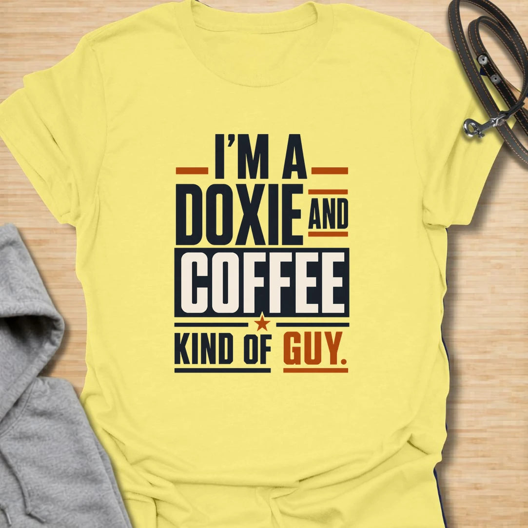 Funny doxie and coffee t-shirt for guys who love dachshunds, caffeine, and simple dog dad style. This bold typography design is perfect for dachshund dads, coffee lovers, dog owners, and anyone whose day starts better with a cup of coffee and a doxie nearby. Also available in a matching girl version, making it a fun couple shirt set for dog-loving coffee drinkers. Great for casual wear, dog walks, coffee runs, weekends, or gifting to a dachshund lover.