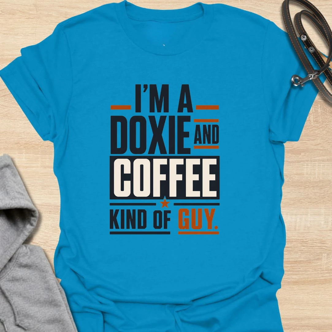 Funny doxie and coffee t-shirt for guys who love dachshunds, caffeine, and simple dog dad style. This bold typography design is perfect for dachshund dads, coffee lovers, dog owners, and anyone whose day starts better with a cup of coffee and a doxie nearby. Also available in a matching girl version, making it a fun couple shirt set for dog-loving coffee drinkers. Great for casual wear, dog walks, coffee runs, weekends, or gifting to a dachshund lover.