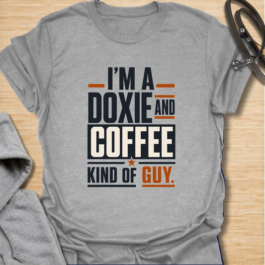 Funny doxie and coffee t-shirt for guys who love dachshunds, caffeine, and simple dog dad style. This bold typography design is perfect for dachshund dads, coffee lovers, dog owners, and anyone whose day starts better with a cup of coffee and a doxie nearby. Also available in a matching girl version, making it a fun couple shirt set for dog-loving coffee drinkers. Great for casual wear, dog walks, coffee runs, weekends, or gifting to a dachshund lover.