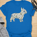 This Floral French Bulldog t-shirt is made for Frenchie lovers who want a softer, prettier take on their favorite little dog. Featuring a French Bulldog silhouette filled with delicate blue flowers, leafy vines, and botanical details, this design blends breed-specific charm with a calm floral style. Perfect for Frenchie moms, Frenchie dads, French Bulldog owners, flower lovers, botanical art fans, and anyone who loves dogs with a gentle garden-inspired twist.