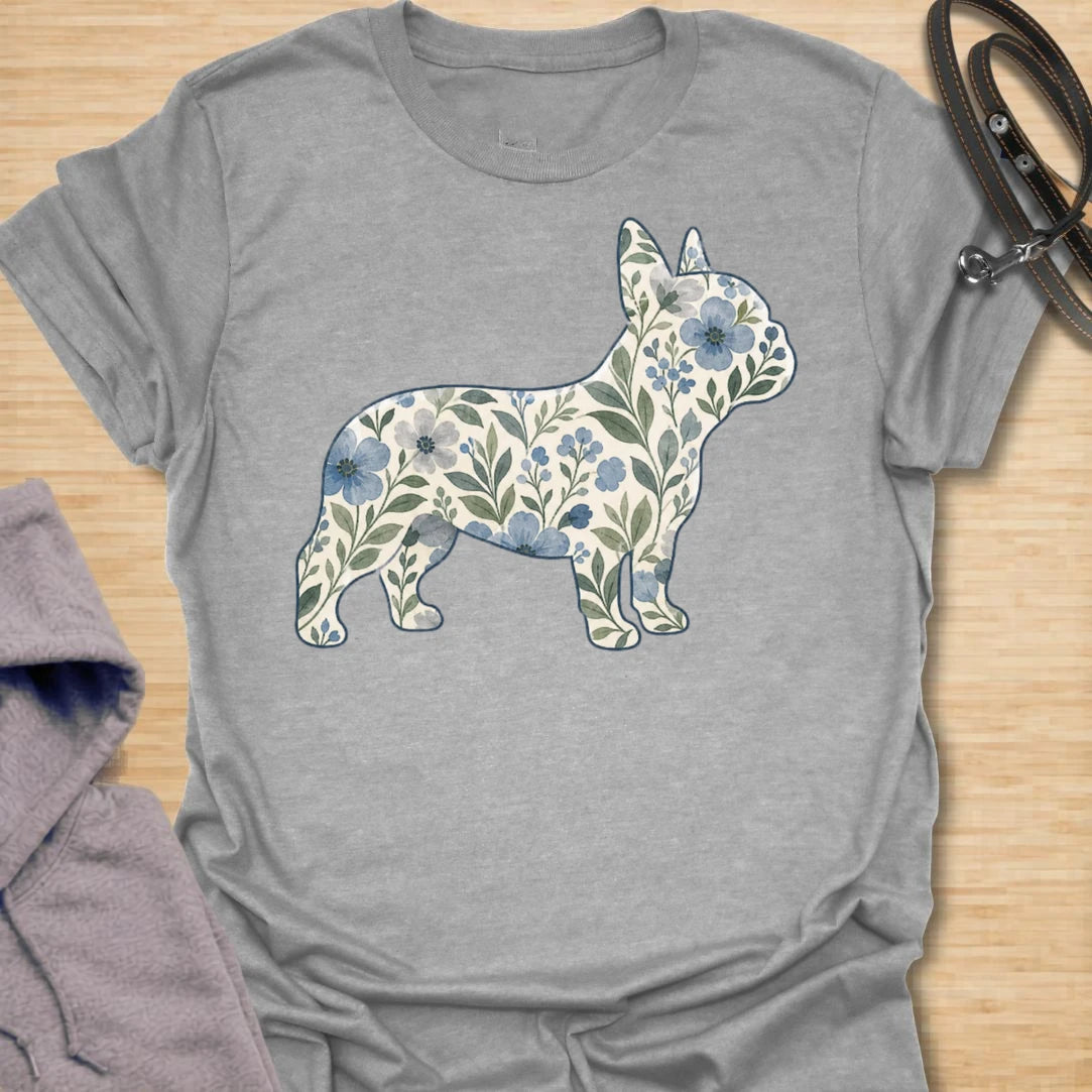 This Floral French Bulldog t-shirt is made for Frenchie lovers who want a softer, prettier take on their favorite little dog. Featuring a French Bulldog silhouette filled with delicate blue flowers, leafy vines, and botanical details, this design blends breed-specific charm with a calm floral style. Perfect for Frenchie moms, Frenchie dads, French Bulldog owners, flower lovers, botanical art fans, and anyone who loves dogs with a gentle garden-inspired twist.