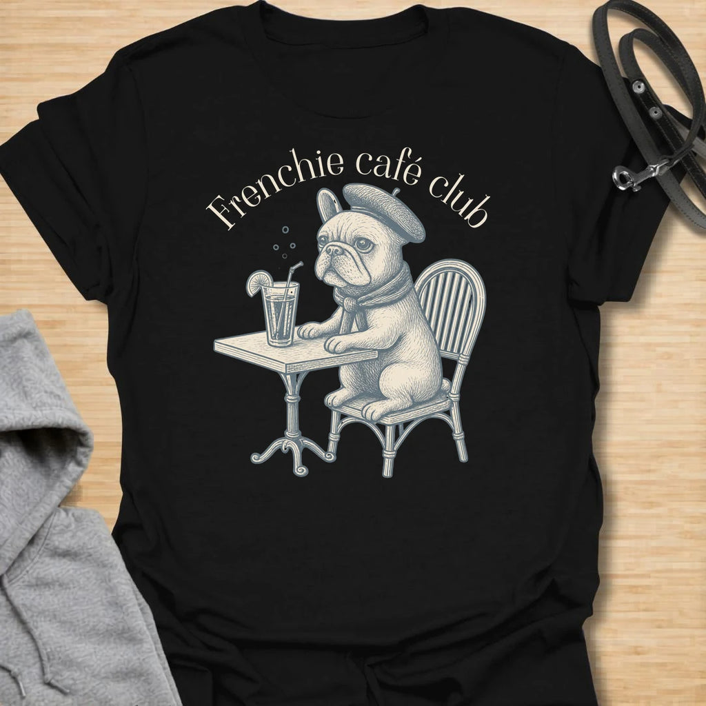 This Frenchie Café Club t-shirt is made for French Bulldog lovers who enjoy a little café charm with their dog-parent style. Featuring a vintage-style Frenchie sitting at a bistro table with a drink and beret, this design has a refined, playful feel with classic French café personality. Perfect for Frenchie moms, Frenchie dads, French Bulldog owners, coffee lovers, café fans, and anyone who loves their small dog with a side of attitude.