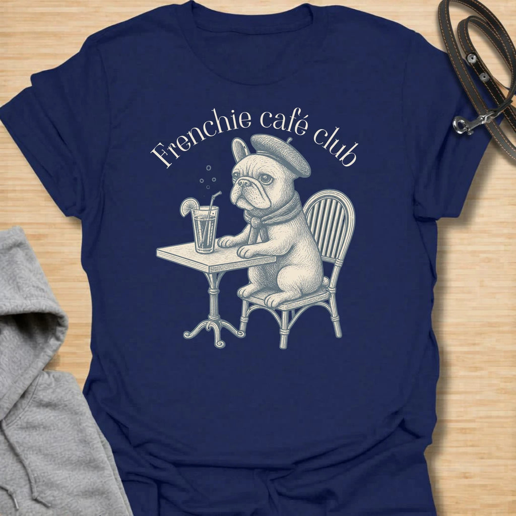 This Frenchie Café Club t-shirt is made for French Bulldog lovers who enjoy a little café charm with their dog-parent style. Featuring a vintage-style Frenchie sitting at a bistro table with a drink and beret, this design has a refined, playful feel with classic French café personality. Perfect for Frenchie moms, Frenchie dads, French Bulldog owners, coffee lovers, café fans, and anyone who loves their small dog with a side of attitude.