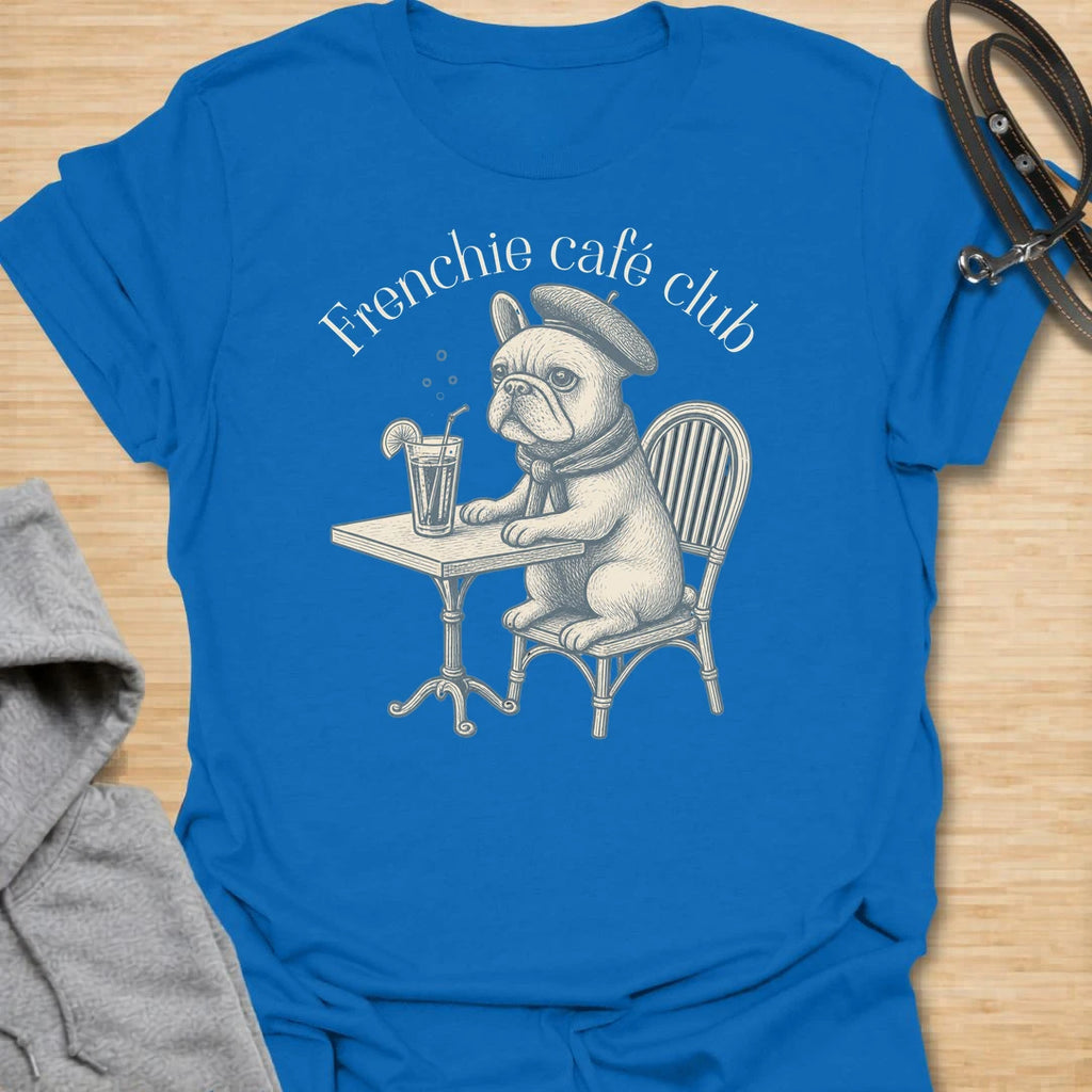 This Frenchie Café Club t-shirt is made for French Bulldog lovers who enjoy a little café charm with their dog-parent style. Featuring a vintage-style Frenchie sitting at a bistro table with a drink and beret, this design has a refined, playful feel with classic French café personality. Perfect for Frenchie moms, Frenchie dads, French Bulldog owners, coffee lovers, café fans, and anyone who loves their small dog with a side of attitude.