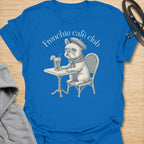 This Frenchie Café Club t-shirt is made for French Bulldog lovers who enjoy a little café charm with their dog-parent style. Featuring a vintage-style Frenchie sitting at a bistro table with a drink and beret, this design has a refined, playful feel with classic French café personality. Perfect for Frenchie moms, Frenchie dads, French Bulldog owners, coffee lovers, café fans, and anyone who loves their small dog with a side of attitude.