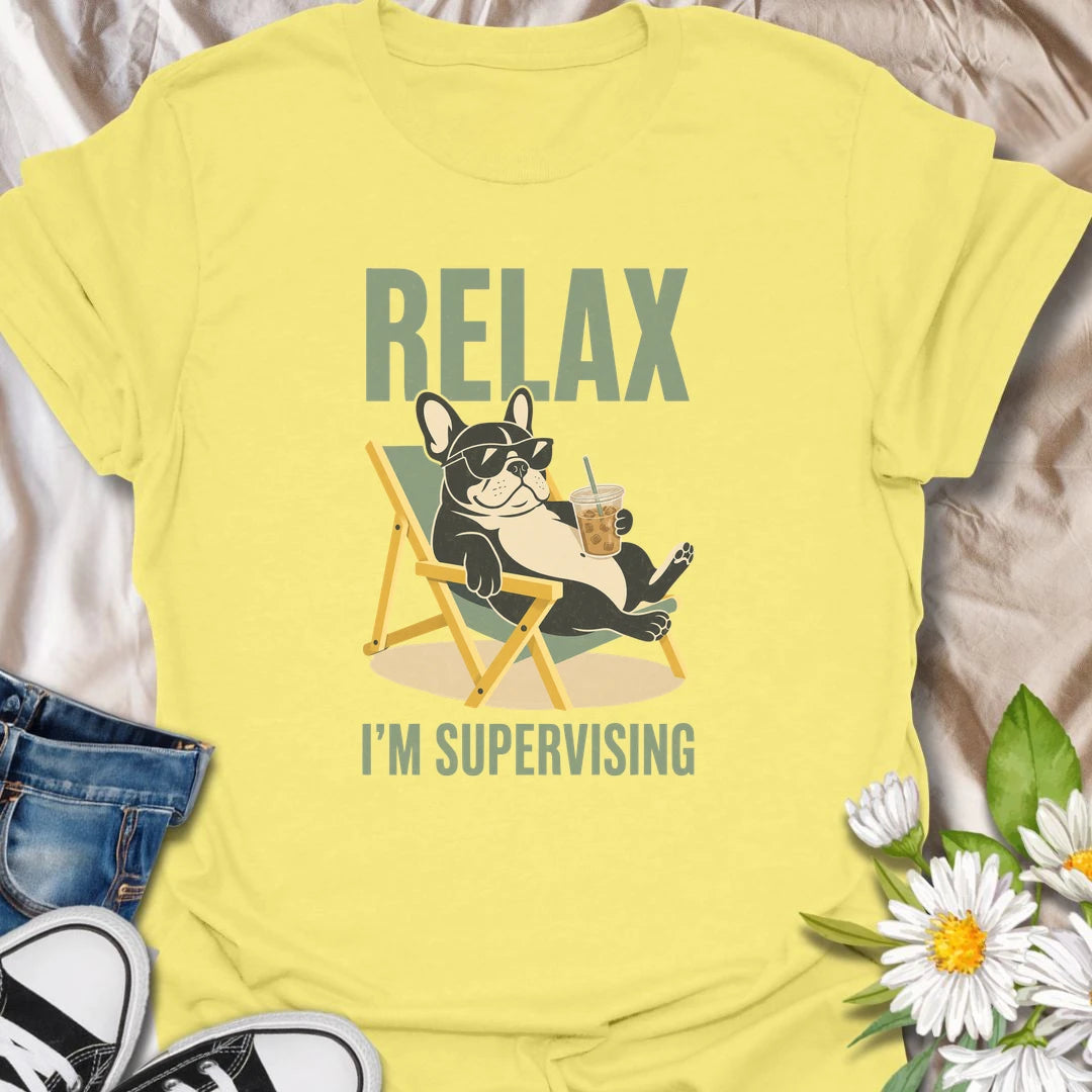 There is no need to worry when a French Bulldog is relaxing nearby and supervising absolutely everything. This funny Frenchie T-shirt features a laid-back bulldog enjoying an iced drink from the comfort of a chair. A playful gift for Frenchie owners who recognize expert-level lounging when they see it.