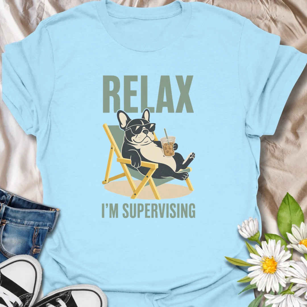 There is no need to worry when a French Bulldog is relaxing nearby and supervising absolutely everything. This funny Frenchie T-shirt features a laid-back bulldog enjoying an iced drink from the comfort of a chair. A playful gift for Frenchie owners who recognize expert-level lounging when they see it.