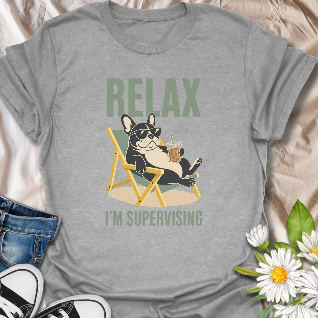 There is no need to worry when a French Bulldog is relaxing nearby and supervising absolutely everything. This funny Frenchie T-shirt features a laid-back bulldog enjoying an iced drink from the comfort of a chair. A playful gift for Frenchie owners who recognize expert-level lounging when they see it.