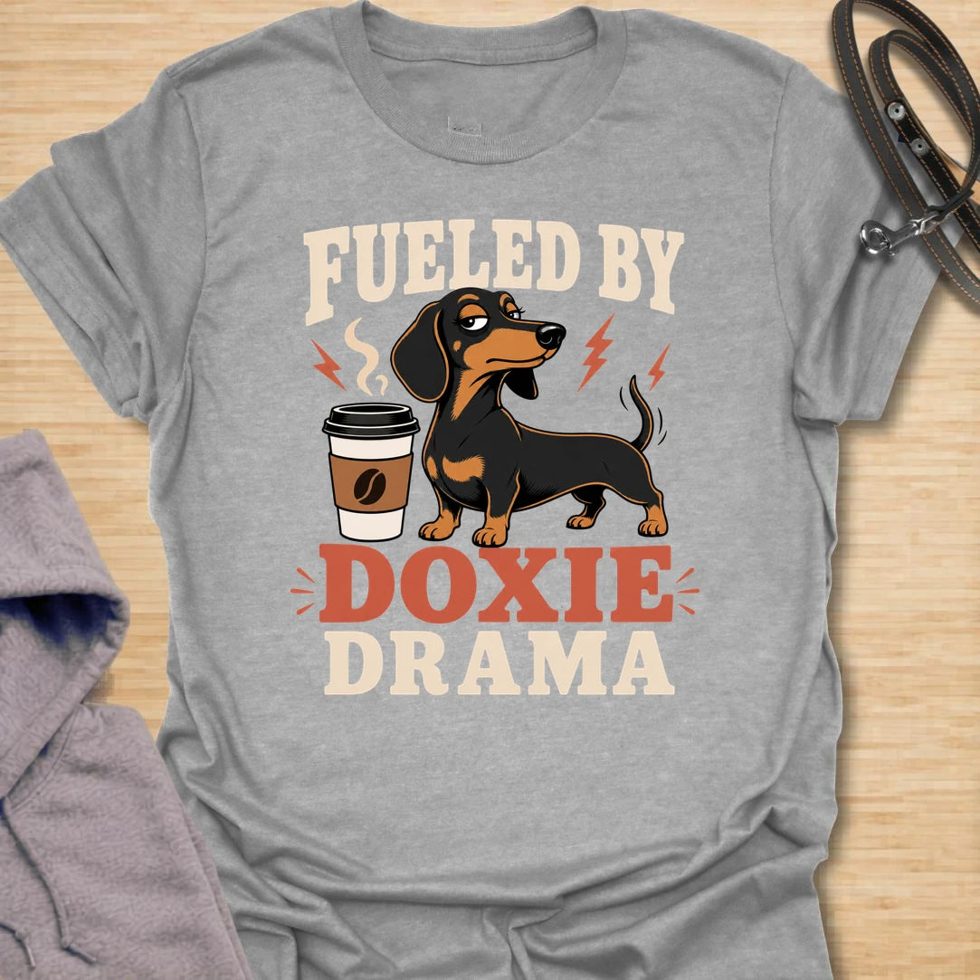 This Fueled By Doxie Drama t-shirt is made for dachshund lovers who know their little long dog brings attitude, opinions, and daily entertainment. Featuring a sassy black and tan dachshund with a coffee cup, bold retro lettering, and playful lightning details, this funny dog design is great for dachshund moms, dachshund dads, coffee lovers, wiener dog fans, and anyone powered by caffeine and doxie chaos.
