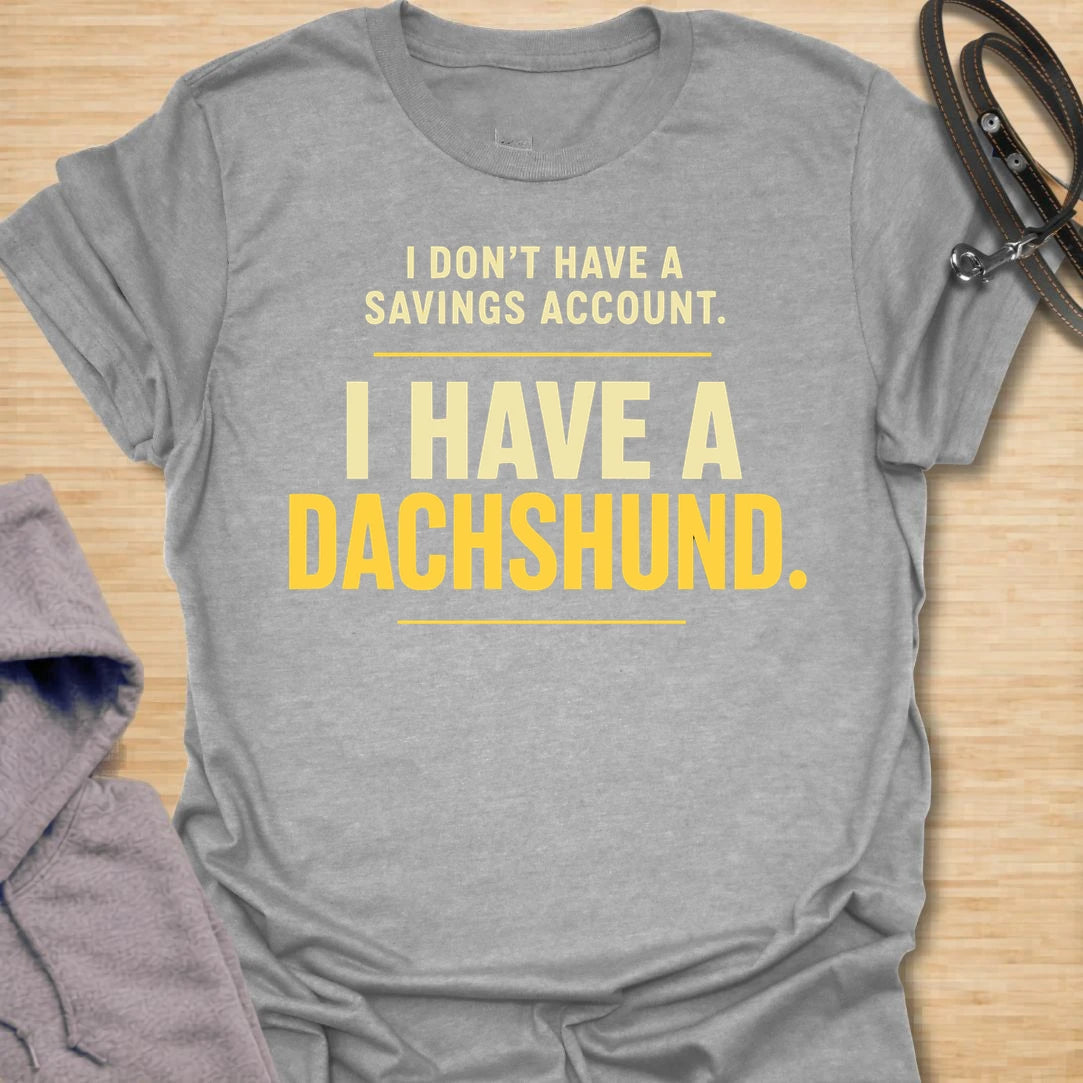 This I Don’t Have A Savings Account I Have A Dachshund t-shirt is made for doxie lovers who know exactly where their money goes. Featuring bold text-only typography with a funny dachshund-owner message, this design has a simple, relatable dog-parent feel that wiener dog fans will instantly understand. Perfect for dachshund moms, dachshund dads, doxie owners, rescue dog lovers, and anyone whose tiny long dog is basically their financial plan.
