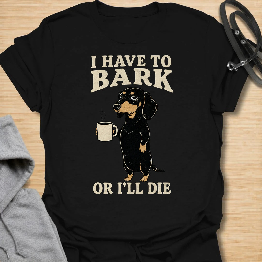 This I Have To Bark Or I’ll Die t-shirt is made for dachshund lovers who know barking is not a hobby, it is a life requirement. Featuring a tired-looking dachshund holding a coffee mug with bold vintage-style text, this design has a funny, dramatic dog-parent feel that doxie owners will instantly understand. Perfect for dachshund moms, dachshund dads, wiener dog fans, rescue dog lovers, coffee lovers, and anyone whose tiny long dog takes noise duty very seriously.