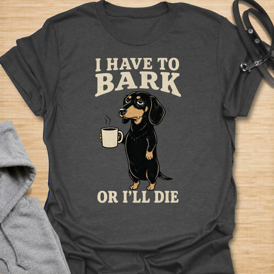 This I Have To Bark Or I’ll Die t-shirt is made for dachshund lovers who know barking is not a hobby, it is a life requirement. Featuring a tired-looking dachshund holding a coffee mug with bold vintage-style text, this design has a funny, dramatic dog-parent feel that doxie owners will instantly understand. Perfect for dachshund moms, dachshund dads, wiener dog fans, rescue dog lovers, coffee lovers, and anyone whose tiny long dog takes noise duty very seriously.