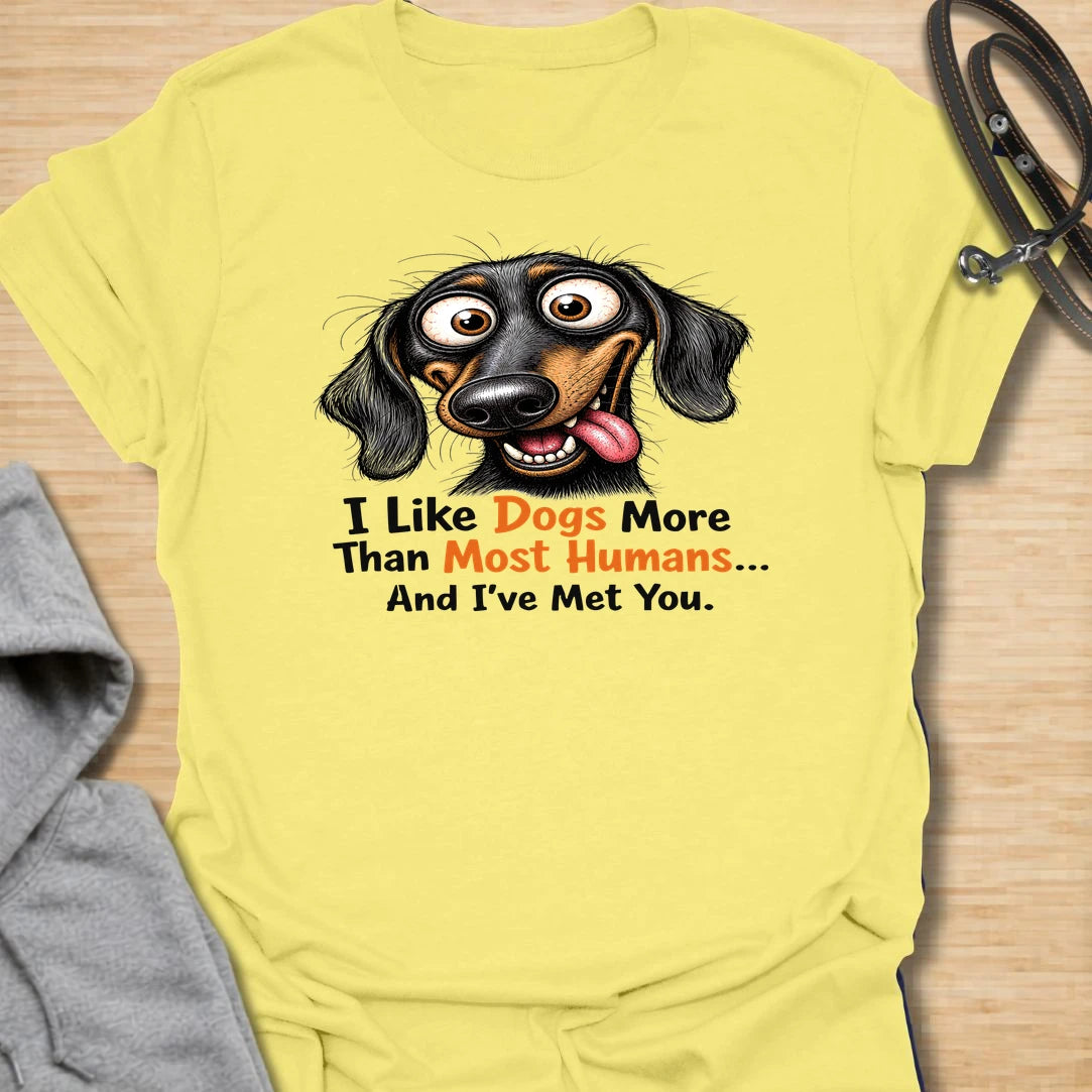 Dogs Over Humans t-shirt for dog lovers who know dogs are easier, kinder, and often much better company. This funny dachshund design says “I Like Dogs More Than Most Humans... And I’ve Met You,” making it perfect for sarcastic pet parents, doxie lovers, and anyone with a strong preference for dogs.