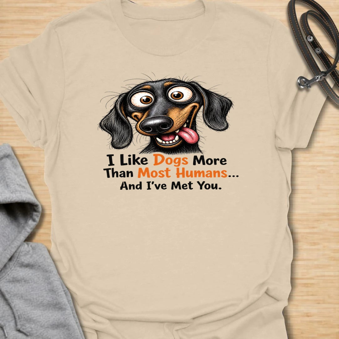 Dogs Over Humans t-shirt for dog lovers who know dogs are easier, kinder, and often much better company. This funny dachshund design says “I Like Dogs More Than Most Humans... And I’ve Met You,” making it perfect for sarcastic pet parents, doxie lovers, and anyone with a strong preference for dogs.