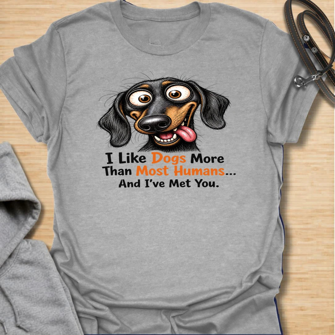 Dogs Over Humans t-shirt for dog lovers who know dogs are easier, kinder, and often much better company. This funny dachshund design says “I Like Dogs More Than Most Humans... And I’ve Met You,” making it perfect for sarcastic pet parents, doxie lovers, and anyone with a strong preference for dogs.
