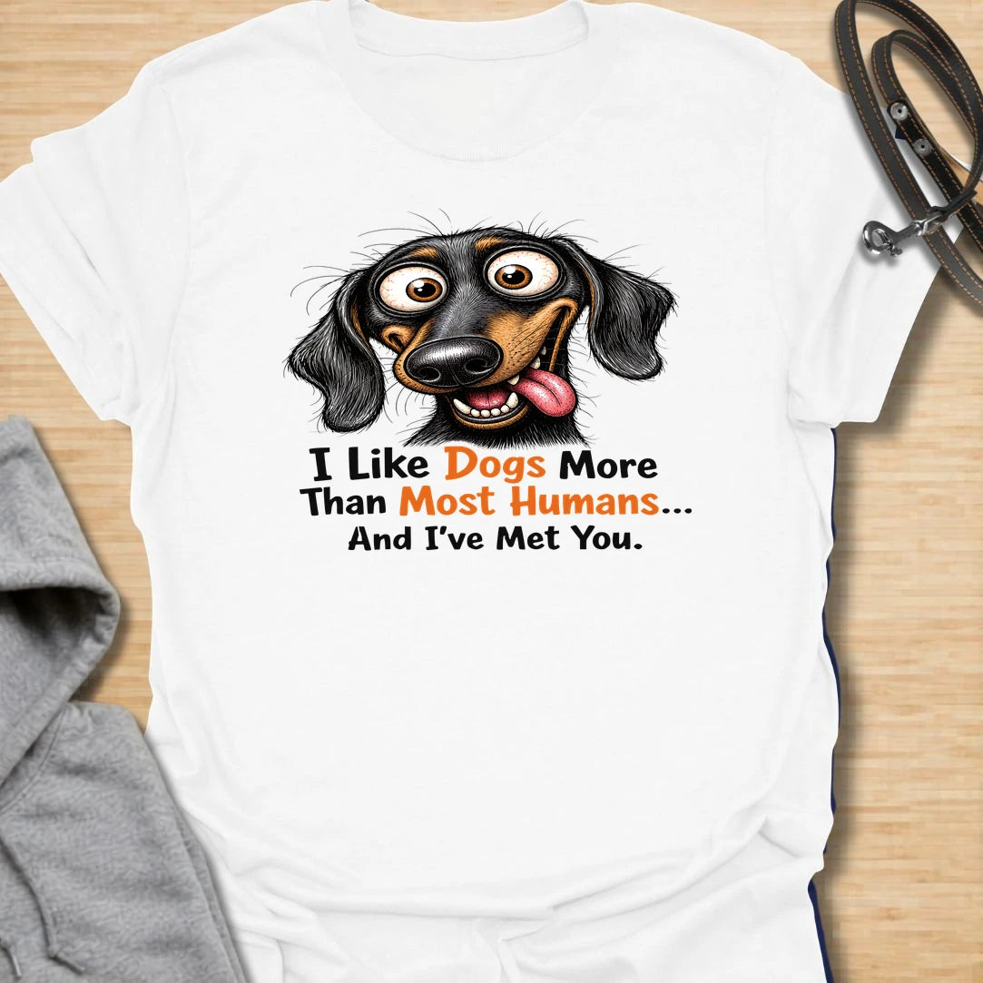 Dogs Over Humans t-shirt for dog lovers who know dogs are easier, kinder, and often much better company. This funny dachshund design says “I Like Dogs More Than Most Humans... And I’ve Met You,” making it perfect for sarcastic pet parents, doxie lovers, and anyone with a strong preference for dogs.
