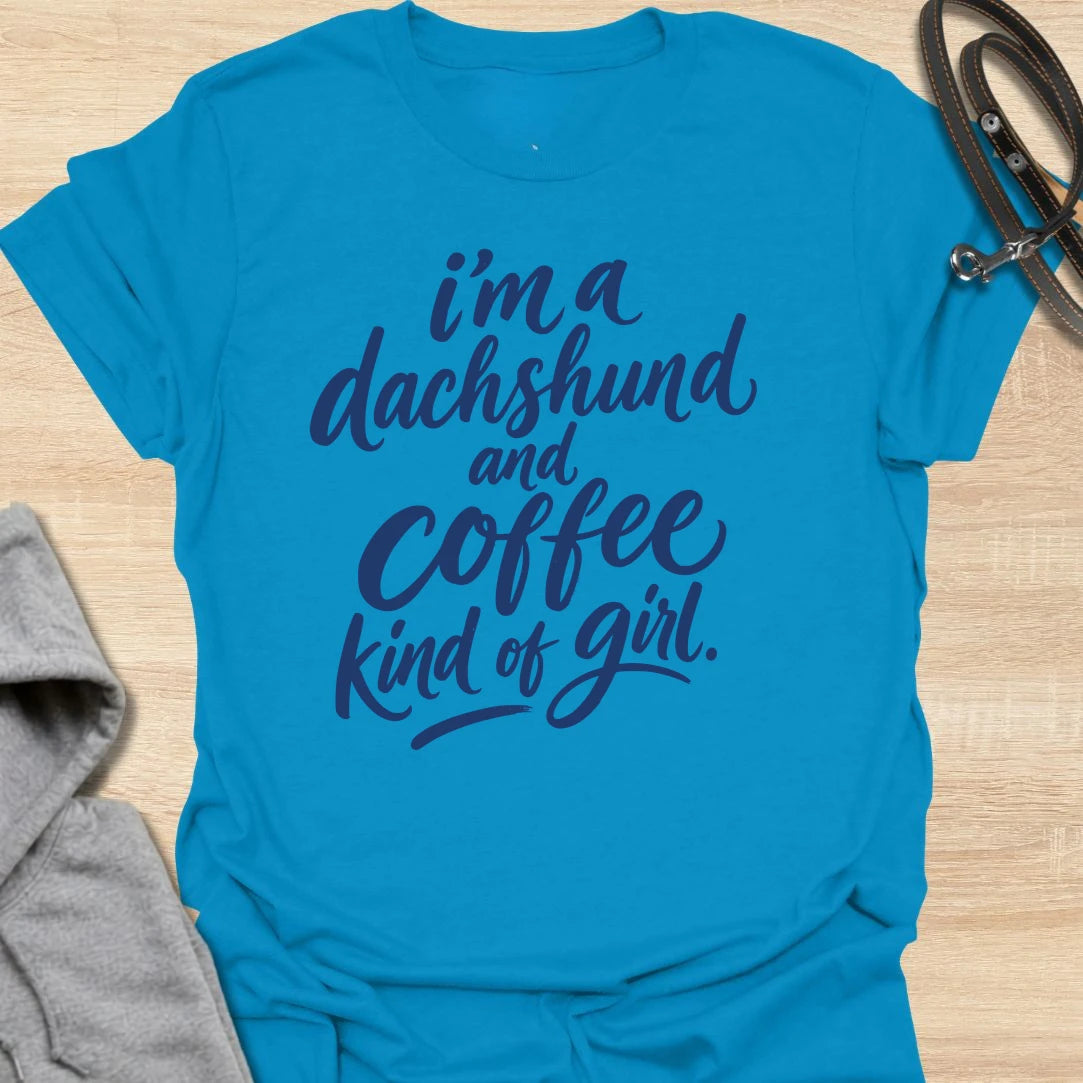 Dachshund and Coffee Girl t-shirt for dachshund people who need coffee before conversation. This bold text design is simple, readable, and made for everyday wear. It is perfect for women who love their wiener dog as much as their morning caffeine. A cute gift for doxie moms, sausage dog lovers, and coffee-obsessed dog people.