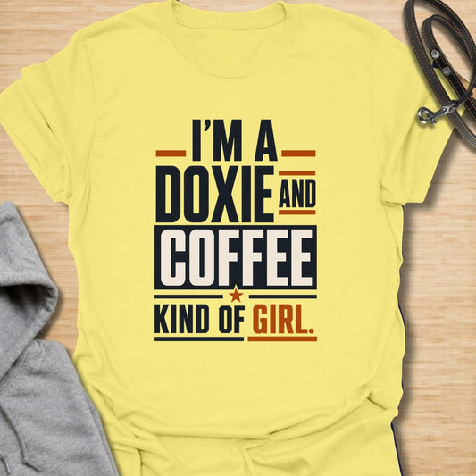Funny doxie and coffee t-shirt for women who love dachshunds, caffeine, and simple dog mom style. This bold typography design is perfect for dachshund moms, coffee lovers, dog owners, and anyone whose day starts better with a cup of coffee and a doxie nearby. Also available in a matching guy version, making it a fun couple shirt set for dog-loving coffee drinkers. Great for casual wear, dog walks, coffee runs, weekends, or gifting to a dachshund lover.