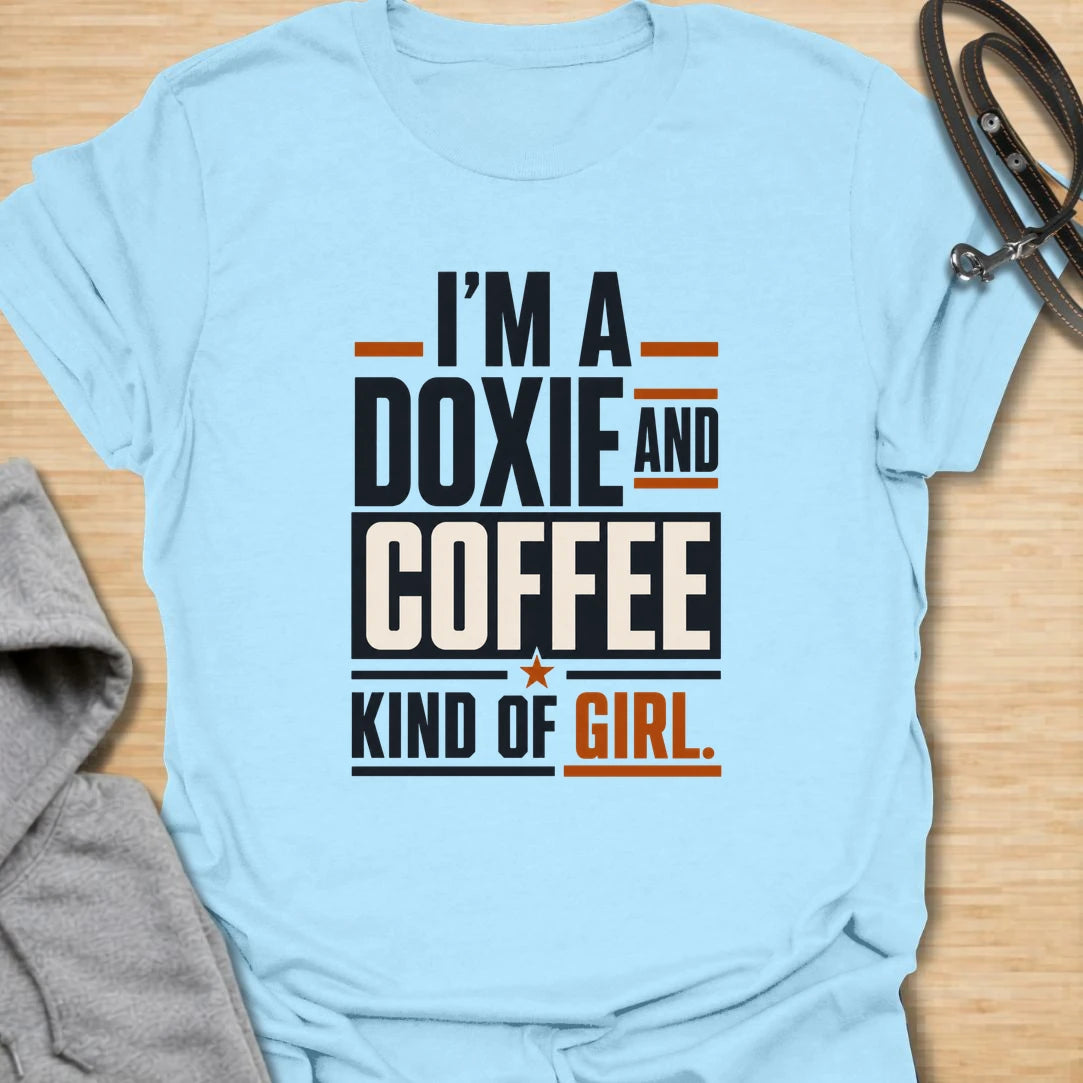 Funny doxie and coffee t-shirt for women who love dachshunds, caffeine, and simple dog mom style. This bold typography design is perfect for dachshund moms, coffee lovers, dog owners, and anyone whose day starts better with a cup of coffee and a doxie nearby. Also available in a matching guy version, making it a fun couple shirt set for dog-loving coffee drinkers. Great for casual wear, dog walks, coffee runs, weekends, or gifting to a dachshund lover.