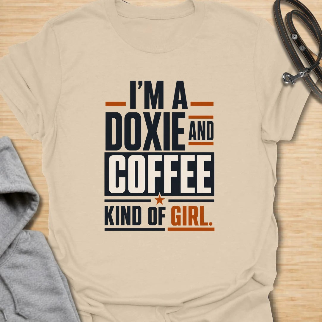 Funny doxie and coffee t-shirt for women who love dachshunds, caffeine, and simple dog mom style. This bold typography design is perfect for dachshund moms, coffee lovers, dog owners, and anyone whose day starts better with a cup of coffee and a doxie nearby. Also available in a matching guy version, making it a fun couple shirt set for dog-loving coffee drinkers. Great for casual wear, dog walks, coffee runs, weekends, or gifting to a dachshund lover.
