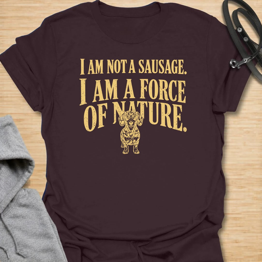This I Am Not A Sausage I Am A Force Of Nature t-shirt is made for dachshund lovers who know their little long dog is far more powerful than their tiny legs suggest. Featuring bold vintage-style typography and a small fierce dachshund illustration, this design has a funny breed-specific attitude that doxie owners will instantly understand. Perfect for dachshund moms, dachshund dads, wiener dog fans, rescue dog lovers, and anyone whose sausage dog is an unstoppable force of nature.