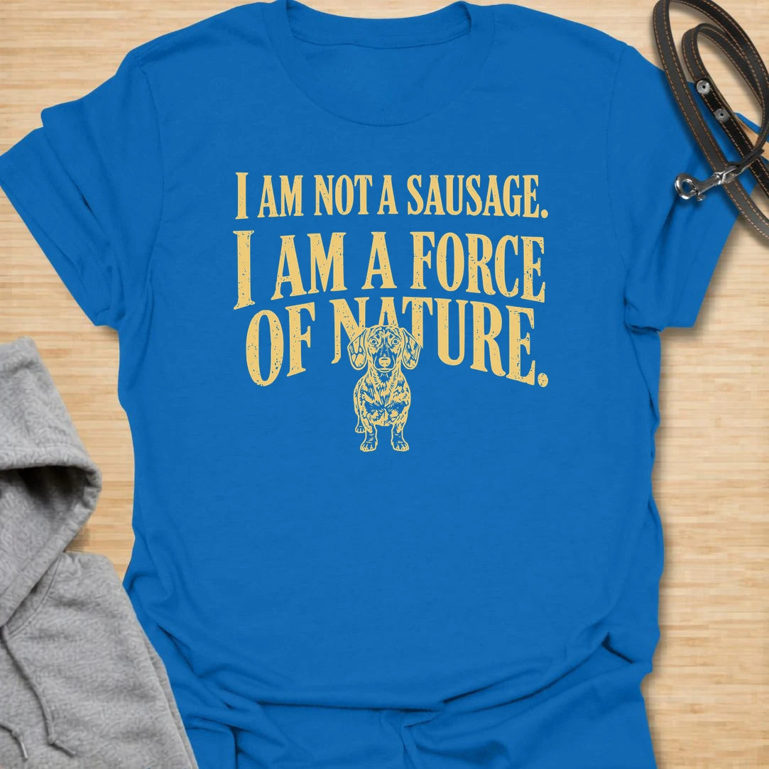 This I Am Not A Sausage I Am A Force Of Nature t-shirt is made for dachshund lovers who know their little long dog is far more powerful than their tiny legs suggest. Featuring bold vintage-style typography and a small fierce dachshund illustration, this design has a funny breed-specific attitude that doxie owners will instantly understand. Perfect for dachshund moms, dachshund dads, wiener dog fans, rescue dog lovers, and anyone whose sausage dog is an unstoppable force of nature.