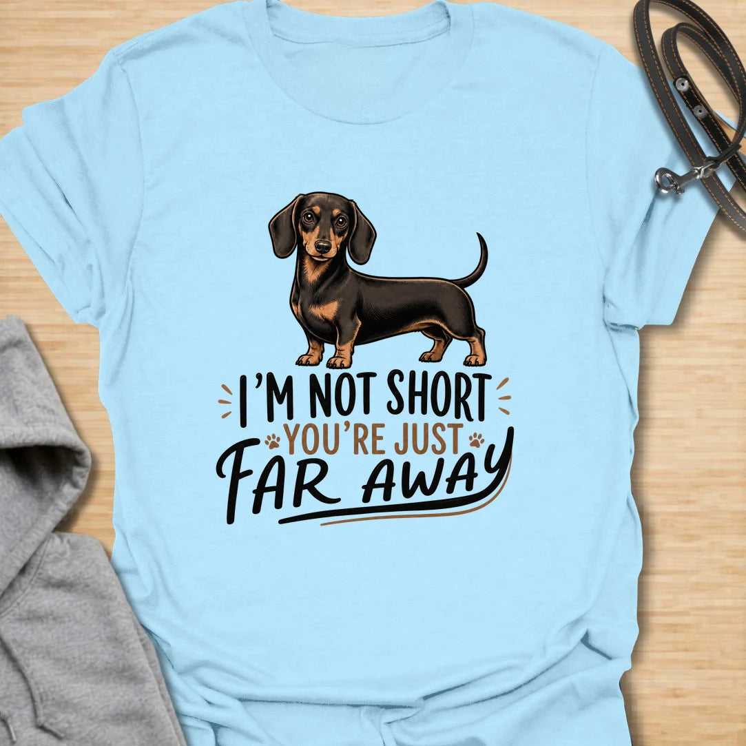 Funny dachshund t-shirt for anyone who knows sausage dogs are not short, everyone else is just far away. This cute design features a classic black and tan dachshund with bold playful lettering. A great gift for dachshund moms, dachshund dads, doxie lovers, wiener dog fans, and anyone who loves small dogs with big personality. Perfect for dog walks, casual weekends, breed meetups, or everyday dachshund-owner humor.