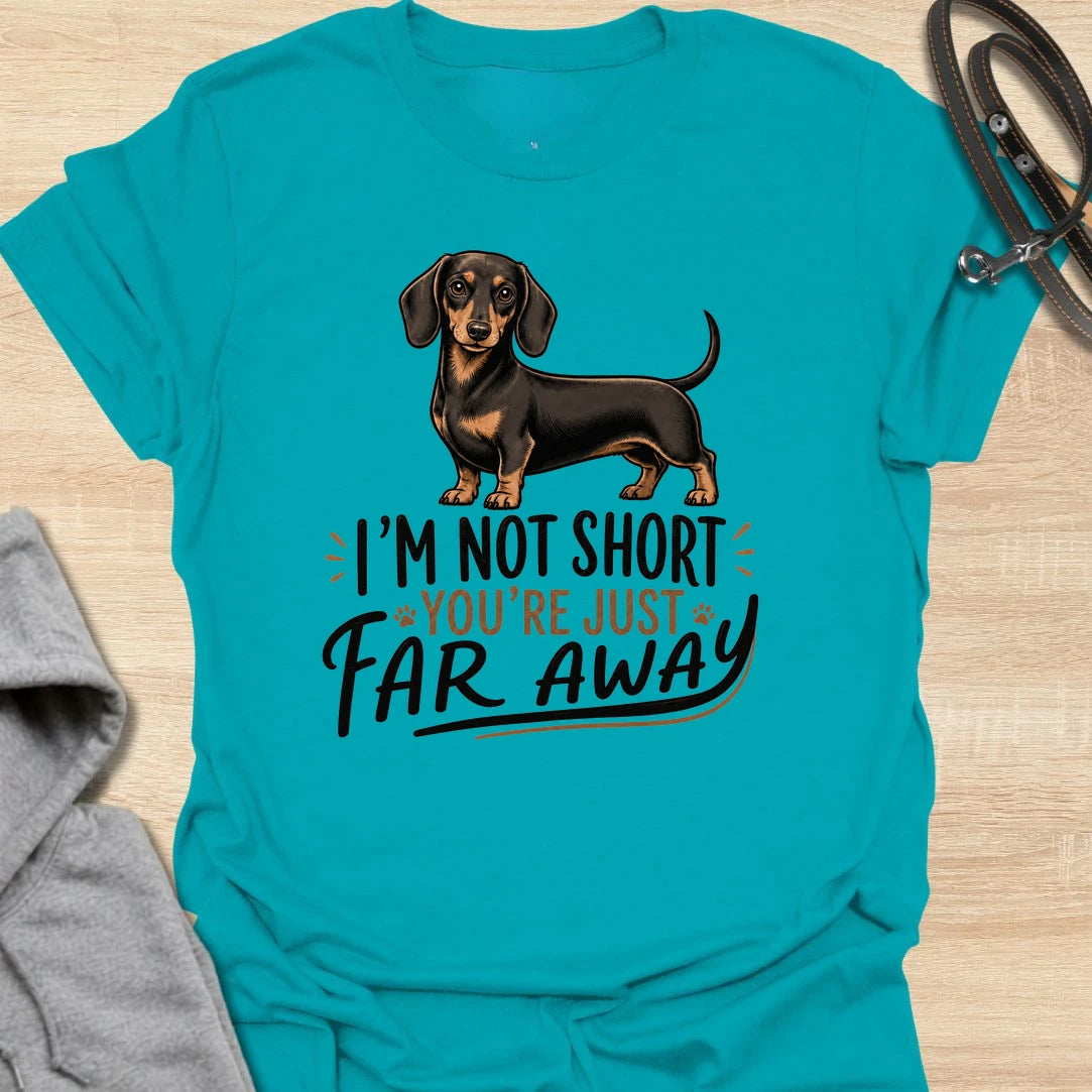 Funny dachshund t-shirt for anyone who knows sausage dogs are not short, everyone else is just far away. This cute design features a classic black and tan dachshund with bold playful lettering. A great gift for dachshund moms, dachshund dads, doxie lovers, wiener dog fans, and anyone who loves small dogs with big personality. Perfect for dog walks, casual weekends, breed meetups, or everyday dachshund-owner humor.