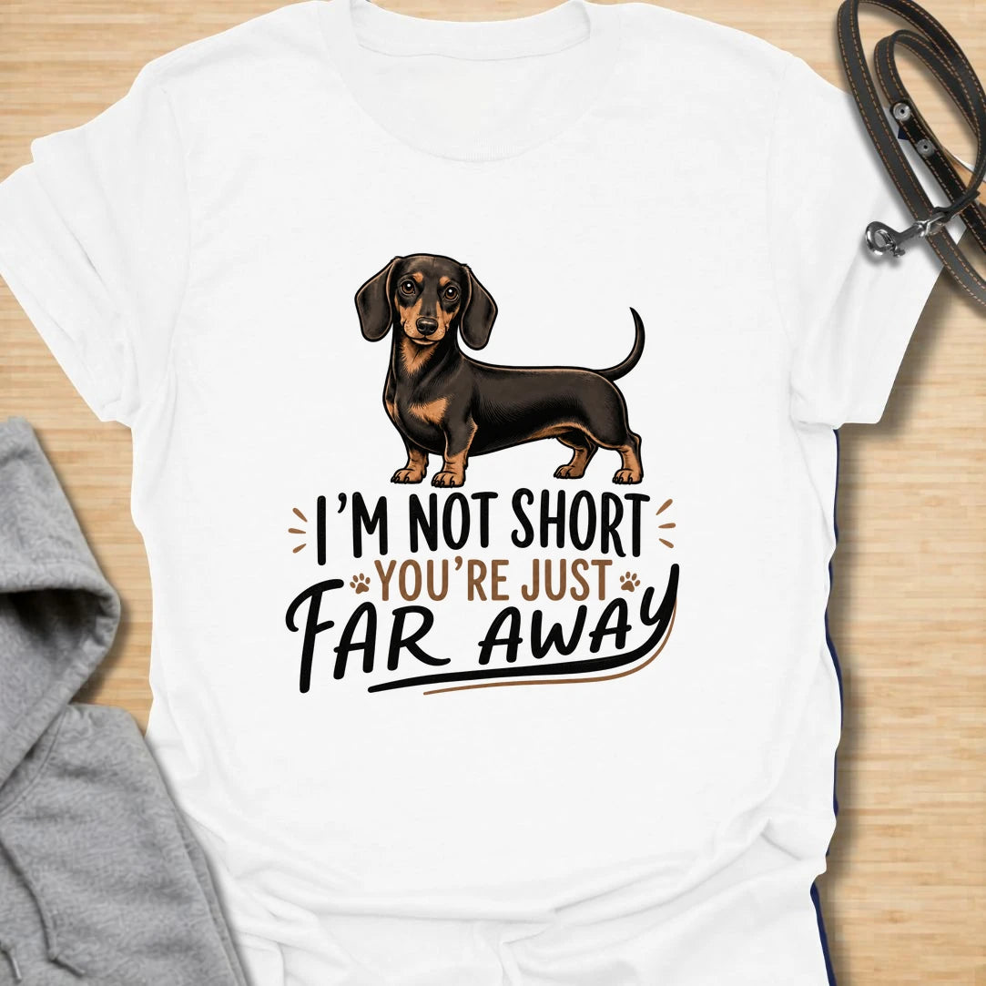 Funny dachshund t-shirt for anyone who knows sausage dogs are not short, everyone else is just far away. This cute design features a classic black and tan dachshund with bold playful lettering. A great gift for dachshund moms, dachshund dads, doxie lovers, wiener dog fans, and anyone who loves small dogs with big personality. Perfect for dog walks, casual weekends, breed meetups, or everyday dachshund-owner humor.