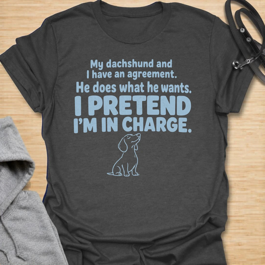 This I Pretend I’m In Charge t-shirt is made for dachshund lovers who know their little long dog makes the rules. Featuring funny text-only styling with a small dachshund line illustration, this design has a relatable dog-parent feel that doxie owners will instantly understand. Perfect for dachshund moms, dachshund dads, wiener dog fans, rescue dog lovers, and anyone whose dachshund does exactly what they want.