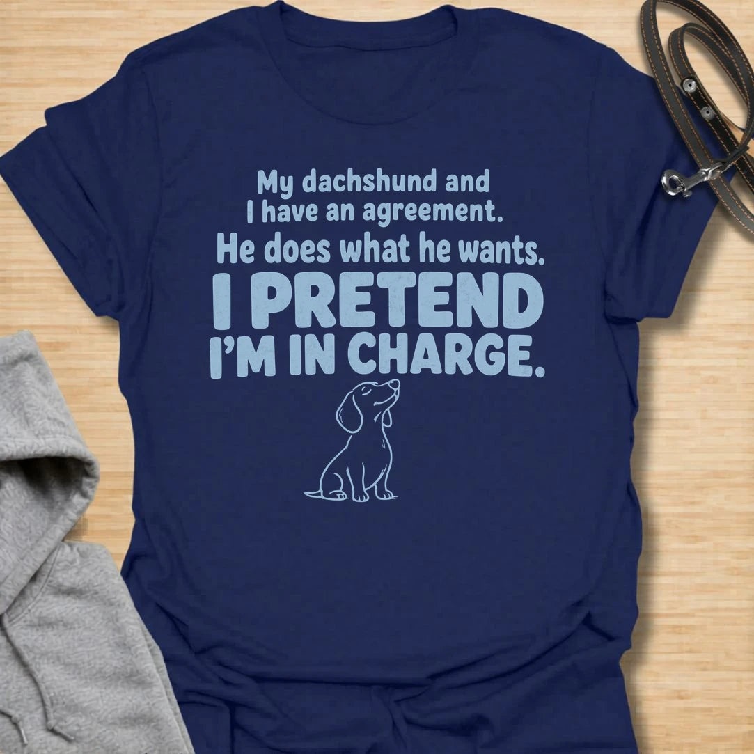 This I Pretend I’m In Charge t-shirt is made for dachshund lovers who know their little long dog makes the rules. Featuring funny text-only styling with a small dachshund line illustration, this design has a relatable dog-parent feel that doxie owners will instantly understand. Perfect for dachshund moms, dachshund dads, wiener dog fans, rescue dog lovers, and anyone whose dachshund does exactly what they want.