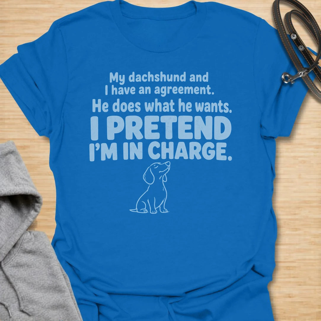 This I Pretend I’m In Charge t-shirt is made for dachshund lovers who know their little long dog makes the rules. Featuring funny text-only styling with a small dachshund line illustration, this design has a relatable dog-parent feel that doxie owners will instantly understand. Perfect for dachshund moms, dachshund dads, wiener dog fans, rescue dog lovers, and anyone whose dachshund does exactly what they want.